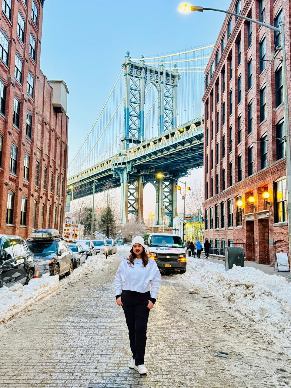Walking beneath the Manhattan Bridge on a snowy street in DUMBO, Brooklyn